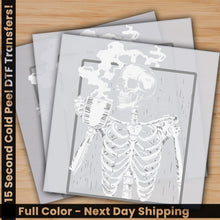 Load image into Gallery viewer, a picture of a skeleton on a wooden table
