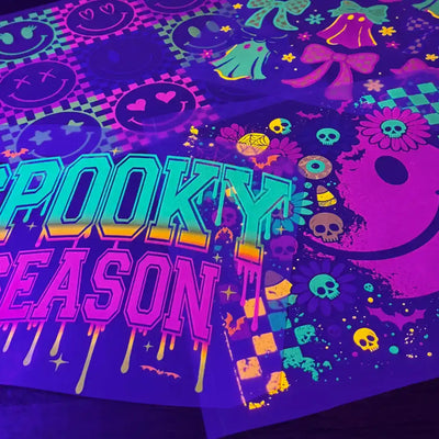 Blacklight reactive Halloween-themed fabric with glow-in-the-dark designs.