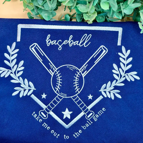 Embroidered blue baseball-themed shirt.