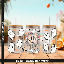 Load image into Gallery viewer, a group of three halloween cans sitting on top of a wooden table
