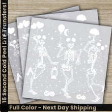 Load image into Gallery viewer, a set of three skeleton paper with balloons and stars
