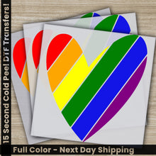 Load image into Gallery viewer, a set of four colorful heart stickers on a wooden surface
