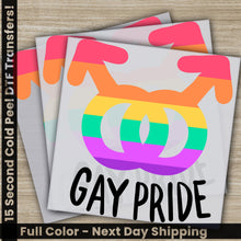 Load image into Gallery viewer, a pair of gay pride stickers sitting on top of each other
