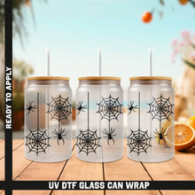 Load image into Gallery viewer, a set of four glasses with a spider web design on them
