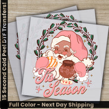 Load image into Gallery viewer, two christmas cards with a santa clause holding a chocolate donut
