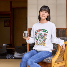 Load image into Gallery viewer, a woman sitting on a chair holding a can of beer
