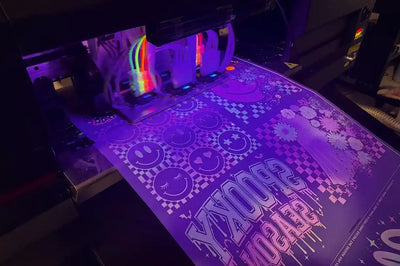 UV printer producing purple and white patterned stickers.