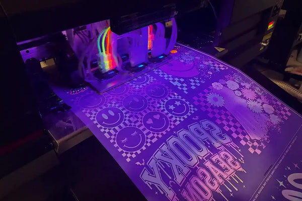 UV printer producing purple and white patterned stickers.