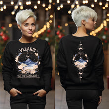 Load image into Gallery viewer, a woman wearing a black sweatshirt with a mountain scene on it
