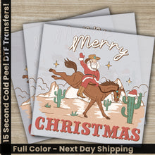 Load image into Gallery viewer, a christmas card with a cowboy riding a horse
