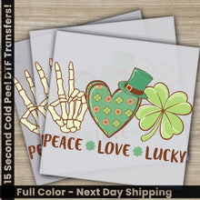 Load image into Gallery viewer, a greeting card with a peace love lucky design
